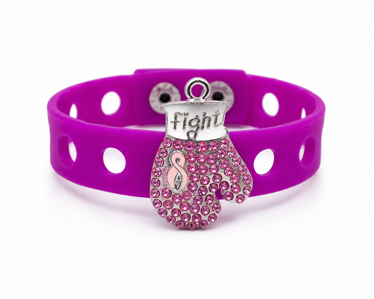 💖 Bold awareness bracelet featuring a sparkling pink rhinestone boxing glove charm and vibrant adjustable silicone band. Stylish, inspiring, and made to empower.