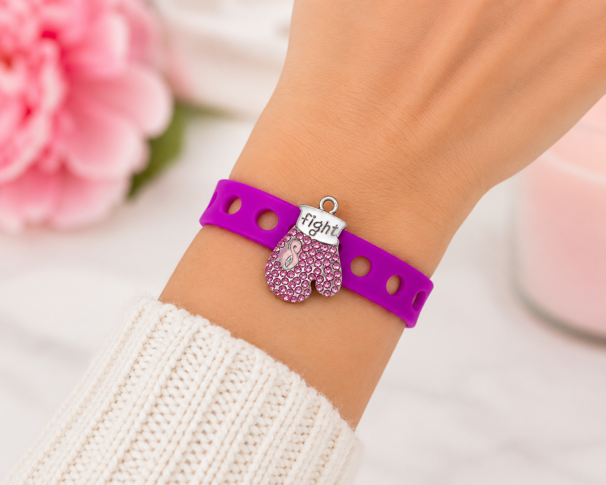 💖 Bold awareness bracelet featuring a sparkling pink rhinestone boxing glove charm and vibrant adjustable silicone band. Stylish, inspiring, and made to empower.