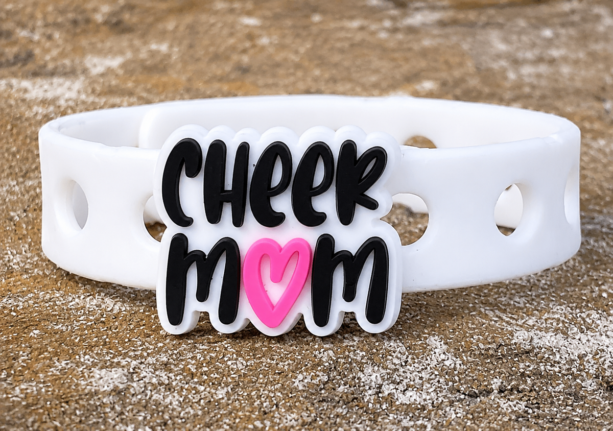 Show your cheer pride with the Cheer Mom Bracelet. Features a bright heart design, adjustable fit, and comfortable everyday wear for proud cheer moms.