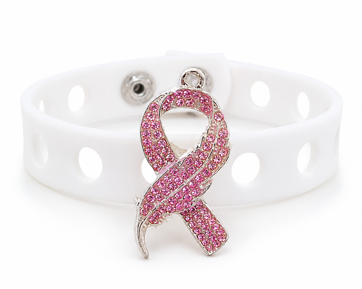 💖 Elegant pink awareness bracelet featuring a sparkling rhinestone ribbon charm and adjustable white silicone band. Stylish, inspiring, and perfect for everyday wear.