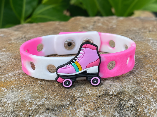 Fun roller skate charm bracelet with an adjustable band. Perfect for kids who love skating, colorful accessories, and playful everyday style.