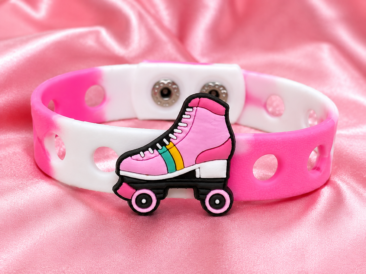 Fun roller skate charm bracelet with an adjustable band. Perfect for kids who love skating, colorful accessories, and playful everyday style.
