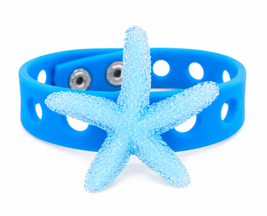 Ocean-inspired bracelet featuring a sparkling starfish centerpiece and vibrant blue silicone band. Perfect for beach lovers, vacations, and coastal style.