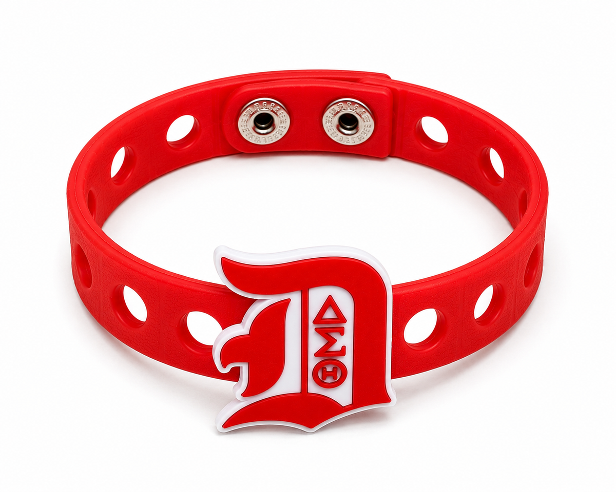 Celebrate leadership, excellence, and sisterhood with the Torch of Excellence Bracelet. A bold red and white snap-lock bracelet designed to inspire and empower.