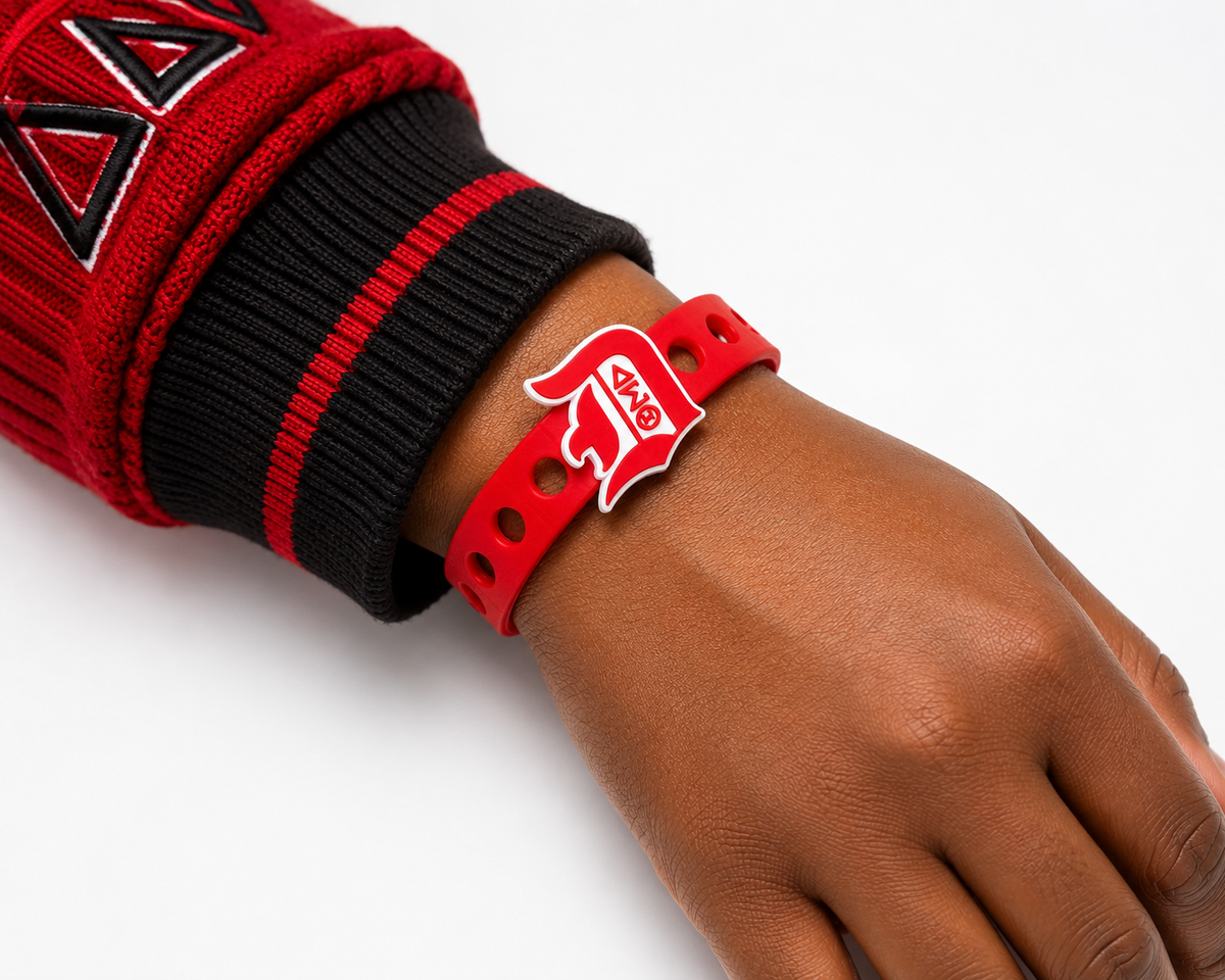 Celebrate leadership, excellence, and sisterhood with the Torch of Excellence Bracelet. A bold red and white snap-lock bracelet designed to inspire and empower.